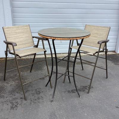 LIDE309 Bistro Patio Set	Set includes 2 chairs with a metal table that has a wicker and glass top. Wicker top shows some wear. Table...