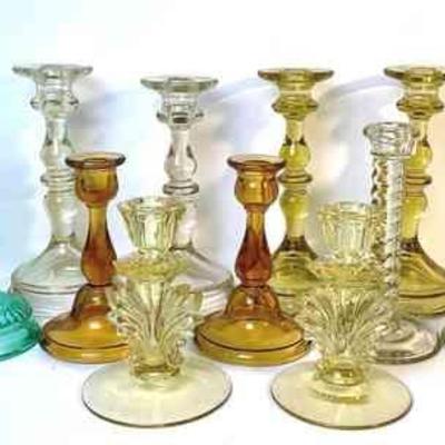 DILA210 Assortment Of Glass Candlesticks	Fostoria "Baroque" #2496 yellow candlesticks. Three Tiffin Art Deco with swirling...