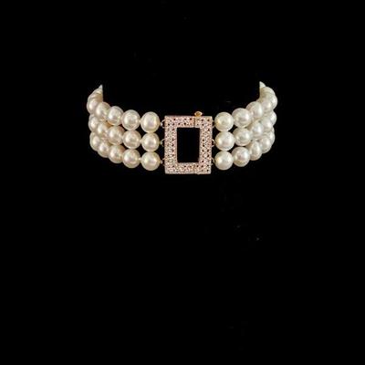 KIHE725 Triple Strand Pearl & 14k Gold Bracelet	Stunning piece, in excellent condition! Three strands of pearls with yellow and white...