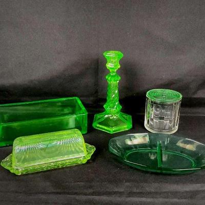 DILA215 Vasaline Glass	Candlestick with snack dish, rectangular dish, butter dish and Norge refrigerator lidded dish. (only lid appears...