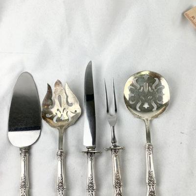 FLRO335 Sterling Serving Pieces - Five	Lot includes:  Carving Knife & Fork, Tomato Server, Salad Server and a Cake Server.
