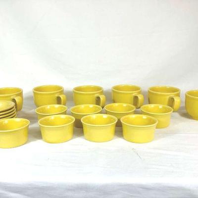 DILA707 Yellow Fiesta Ware Cups & Bowls	Collection of yellow Fiestaware dishes. Includes six soup mugs, eight ramekin bowls, and six...