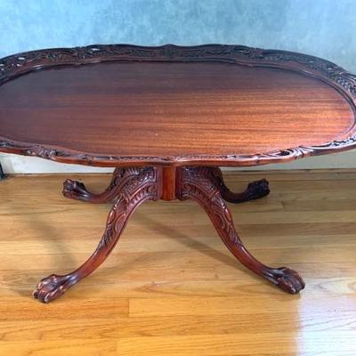 Carved mahogany coffee table