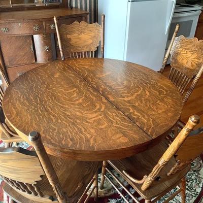 Antique oak claw ft. table w/ 2 leaves together w/ a set of 6 oak reproduction pressed back chairs