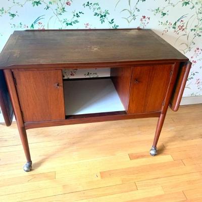 MCM rolling walnut drop leaf bar cart, needs refinishing.