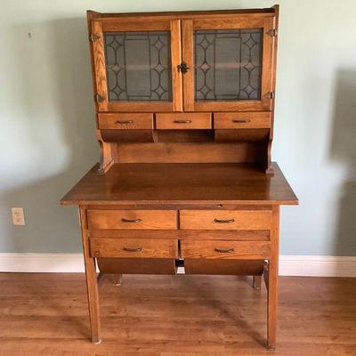 Hoosier with double possum belly on lower drawers and upper, etched glass, all original.
