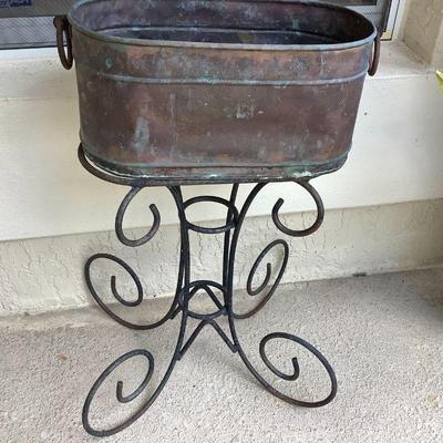 Copper pail on stand