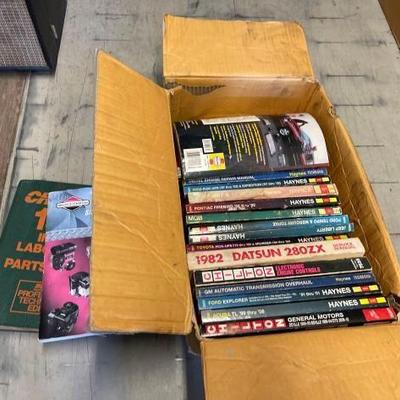 #4096 • Box Full of Car Manuals
