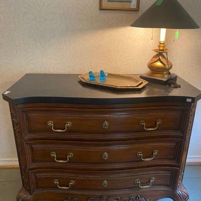 Low chest of drawers with faux black marble