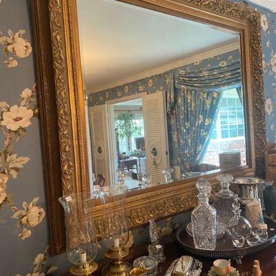 Large beveled mirror with gold trim