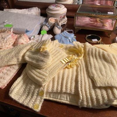 Baby knitted bonnet, cape and booties