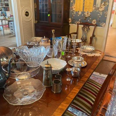 Dining room with beautiful serving pieces and Antique mahogany cabinet