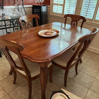 $375-table with 4 pineapple, wooden/upholstered chairs, 30"H 60"L 38"depth