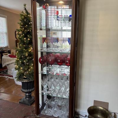 $140- lighted Curio cabinet with right side door that opens 71"H 22"L 12"depth