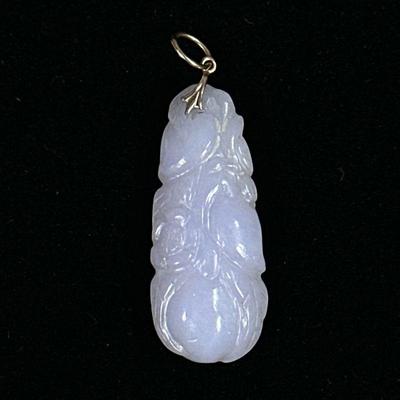 CARVED JADE PENDANT | Carved white jade pendant with floral design. - l. 1.5 in

