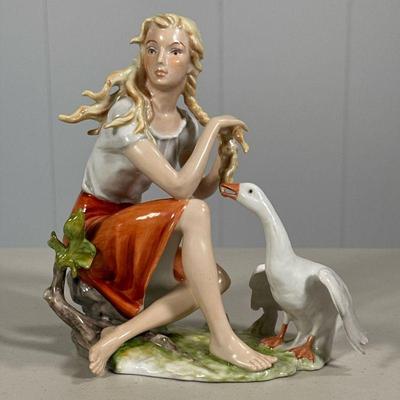 AK KAISER GIRL WITH GOOSE FIGURINE | Porcelain figurine depicting girl with goose, hand painted and marked on bottom. - l. 6 x w. 3 x h....