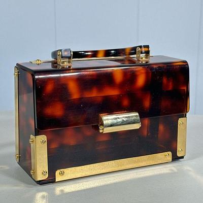 VINTAGE LUCITE HANDBAG | Tortoiseshell Banded lucite handbag with riveted brass edges and latch. - l. 8 x w. 3 x h. 5 in

