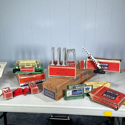 (7PC) VINTAGE LIONEL TRAINS SCENERY PIECES | Including: No. 110 Trestle Set, No. 111 Trestle Set, No. 310 Billboard Set, No. 3656...