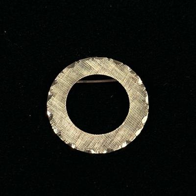 14K GOLD CIRCLE PIN | Designed as a 14K gold circular pin/brooch, marked on back "14K TC"; 1 in., 2.1g.

