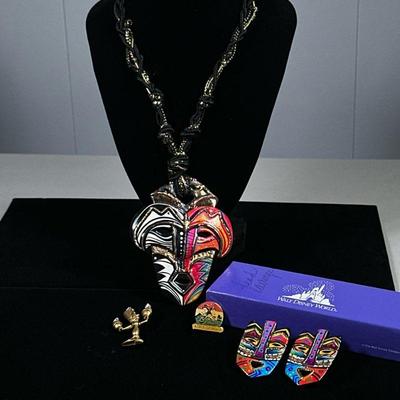(5PC) DISNEY COSTUME JEWELRY | Includes: large tiki mask necklace with matching earrings, Lumiere brooch, and World Showcase pin.

