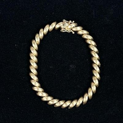 14K GOLD BRACELET | Twisted link 14K gold bracelet, marked on clasp "14K Italy" 15.3 g. - l. 7 in

