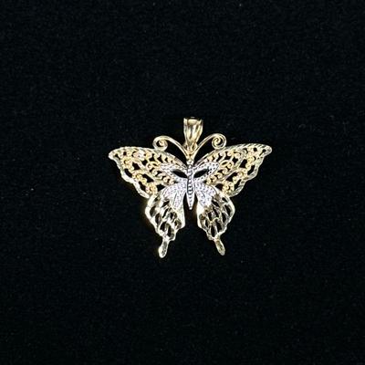 14K GOLD BUTTERFLY PENDANT | Designed as a 14K gold butterfly-form pendant, marked on loop "14K OR"; 1.25 in., 2.2g.


