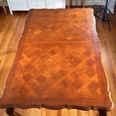 CENTURY FURNITURE COEUR DE FRANCE COSTELLANE DINING TABLE | Extendable cherry dining table with parquet top over carved cabriole legs....