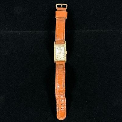 VINTAGE 14K GOLD BULOVA MENS WATCH | 14K Solid gold Bulova mens watch with leather strap, marked on back "B-14K SOLID GOLD";...