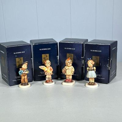 (4PC) HUMMEL FIGURINES IN ORIGINAL BOX | Including: Two Hands, one Treat Hum 493, Lucky Fellow Hum 560, A Sweet Offering Hum 549/3/0, and...