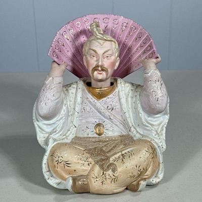 PORCELAIN CHINOISERIE MALE NODDER | Showing man in decorative gilt robe with fan with nodding head. - l. 6 x w. 6 x h. 6.5 in

