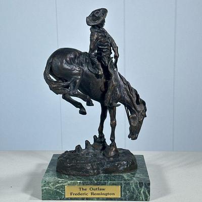 FREDERIC REMINGTON (1861-1909) BRONZE | “The Outlaw” bronze sculpture by Frederic Remington, signed and mounted on stone base. - l. 7 x...