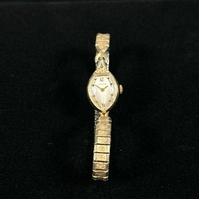 VINTAGE 14K GOLD LONGINES WOMENS WATCH | Vintgae 14K gold Longines womens watch with elastic metal band, marked on back 