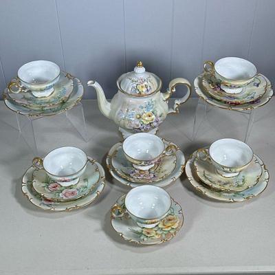 (18PC) C.B. MEREDITH FLORAL TEA SET | Hand Painted tea set including: large floral & gilt tea pot and 6 sets of floral and and gilt...