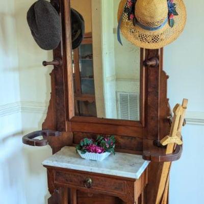 For immediate purchase-Hall tree Walnut with cast iron dishes for canes and umbrellas. 36.5" w x 11" d x 78" H/ $695....