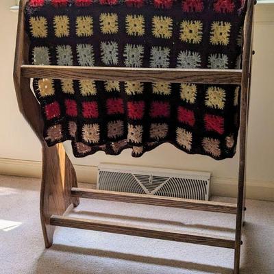 Crochet afghan on quilt rack