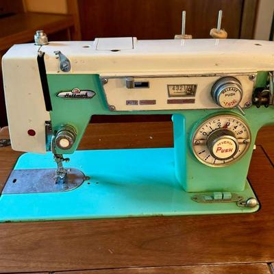 Retro vintage sewing machine. It turns on but needs some motor love. Isn't the color classic?!