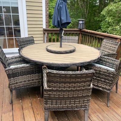 Dine in style with the Lorca dining set, featuring a woven top, and rotating lazy Susan. Crafted from durable wicker with a light tan and...