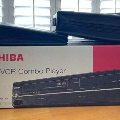 NVN070- Toshiba DVD Player And Two Cases Of DVD Movies