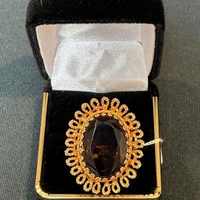 14k gold and gemstone.