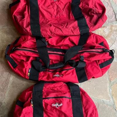 (3) Eagle Creek Red Cargo Duffel Bags - (2) Large And (1) Regular