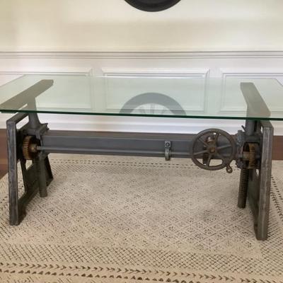 $375-Industrial crank desk with glass top, 30”H 68”L 32”depth