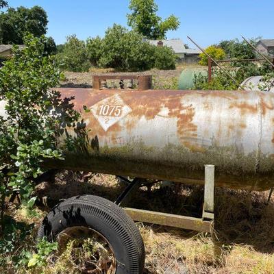 Propane Tank on trailer dolly  https://levyestateservices.hibid.com/lots