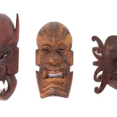 Group of Tibetan and Dayak Wood Carved Masks