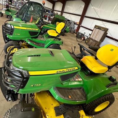 4 models of John Deere. 2 mowers, 2 Gator style