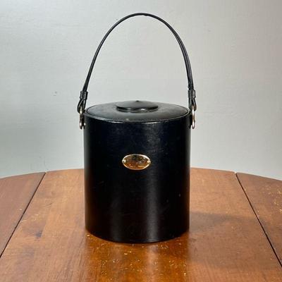 VINTAGE LEATHER GEORGE BRIARD ICE BUCKET | Leather-covered ice bucket with lid and bail handle. - l. 9 x w. 8 x h. 9 in

