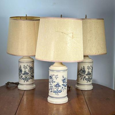 (3PC) FLORAL CROCK-FORM LAMPS | Ceramic crock-form lamps having blue floral design with gilt rims. - h. 24 x dia. 5.5 in

