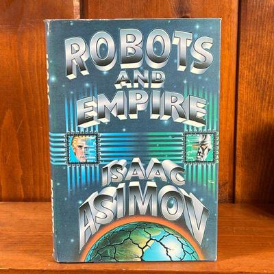FIRST EDITION: ROBOTS AND EMPIRE BY ISAAC ASIMOV | First edition of Robots and Empire by Isaac Asimov, hardcover with dust jacket. - l. 6...