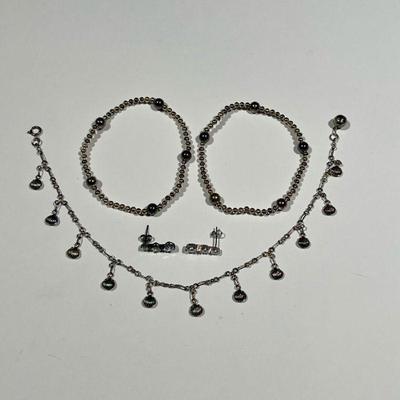 STERLING SILVER PENNY WEIGHTS JEWELRY | Including 2 bracelets, a pair of earrings, and a seashell and bell ankle bracelet

