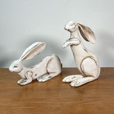 PAIR WOOD CARVED & PAINTED RABBITS | Wood carved and white painted decorative bunny rabbits. - l. 8-1/2 x w. 3 x h. 7-1/2 in


