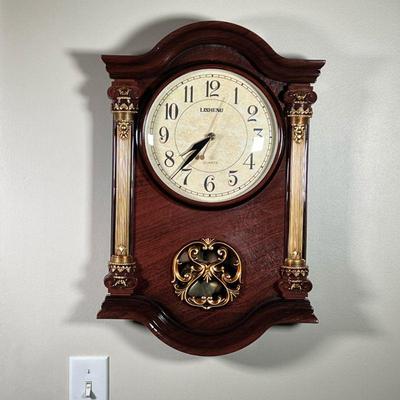 LISHENG MODERN WALL CLOCK | Almost in brand new condition working wall clock with all pieces intact. - l. 15 x w. 3-1/2 x h. 22-1/2 in

